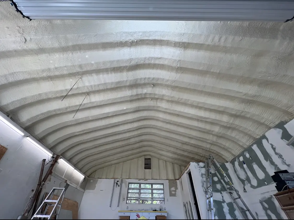 Spray polyurethane foam applied to the underside of a metal roof deck in DuBois