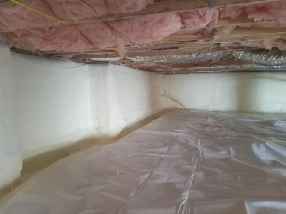Crawl space encapsulation with closed-cell spray foam for Commercial Roof Restoration in DuBois